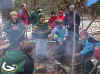 The hard-working scouts enjoy campfire hot dogs